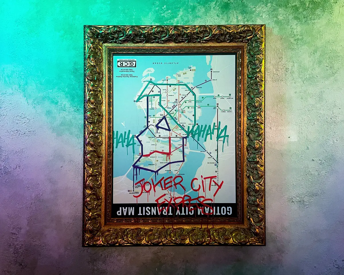 Framed Gotham City transit map poster vandalised with Joker City graffiti