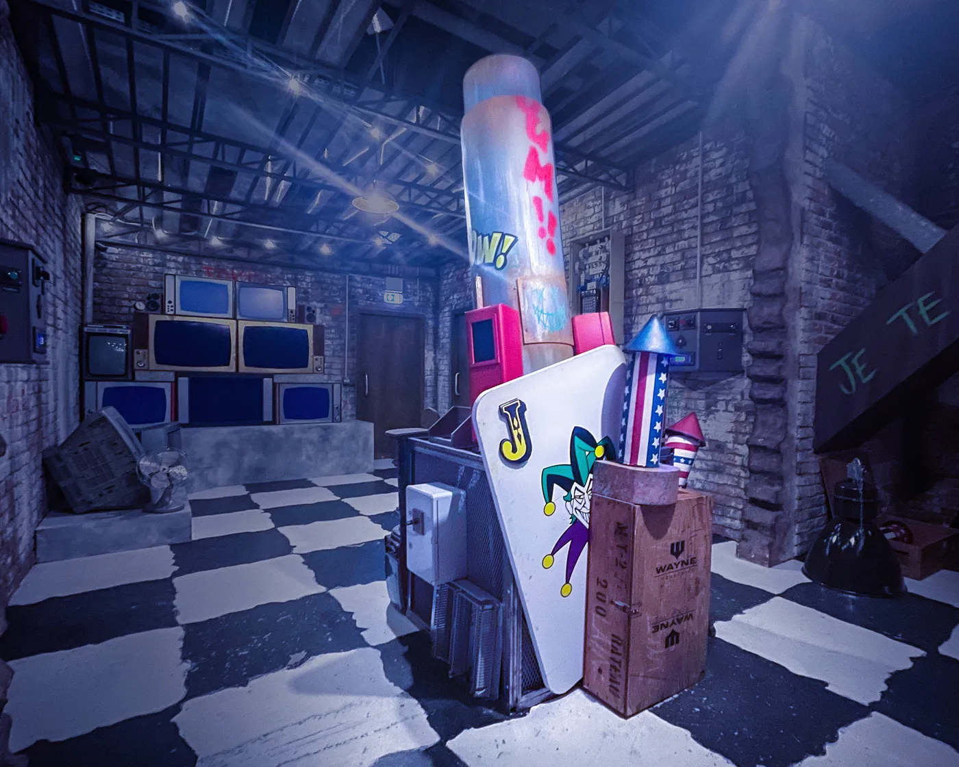The finished Joker machine installed in the immersive room with a checkerboard floor