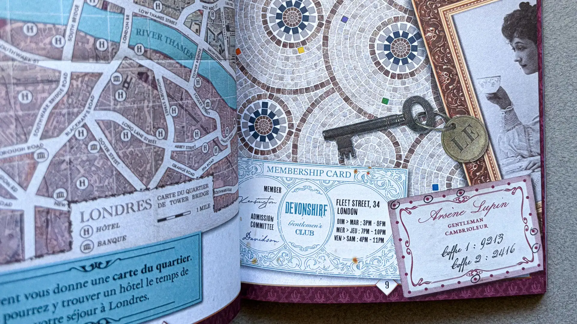 Open spread of Arsène Lupin et la Pie voleuse with a Belle Époque London map, an antique key, a club membership card and Lupin's calling card