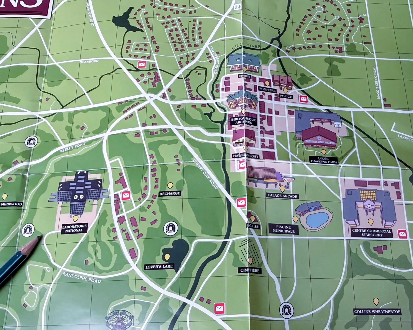 Close-up of the illustrated Hawkins town map with the National Laboratory, Palace Arcade and Starcourt mall