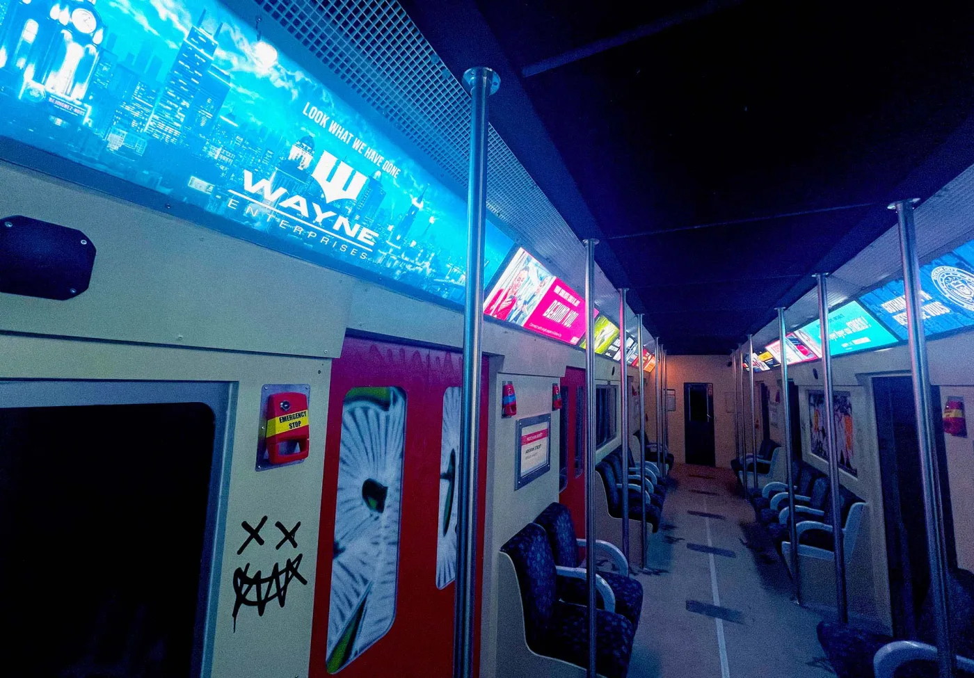 Gotham City subway car interior branded Wayne Enterprises